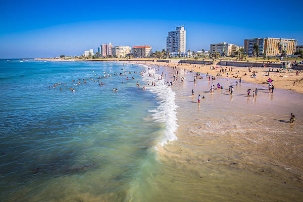 Port Elizabeth, South Africa - January 25, 2015: Port Elizabeth, South Africa - 18 JANUARY 2015, Look at the people on the beach enjoyng the sund at waterfront of Port Elizabeth